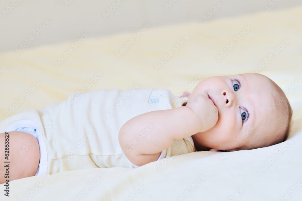Baby with fingers in his mouth
