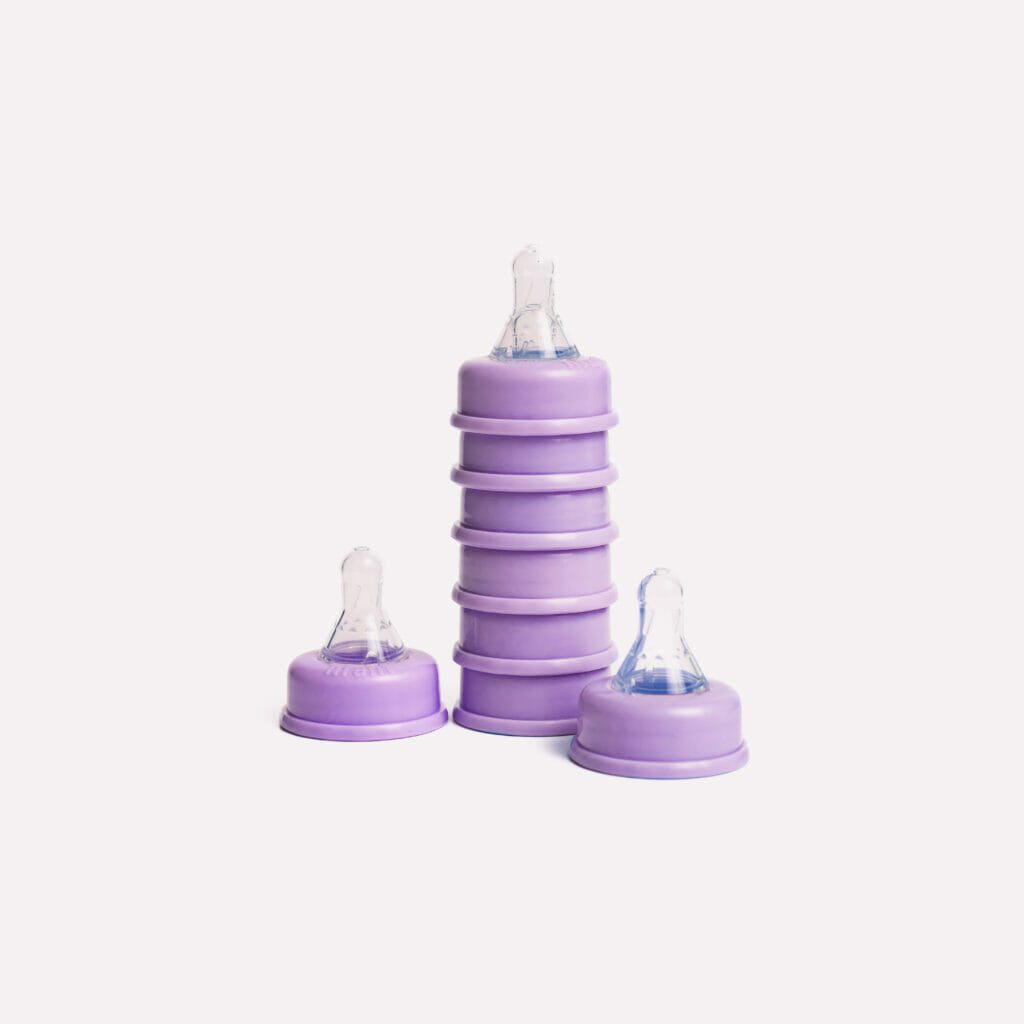 A stack of nfant® Slow Flow Nipples is shown. These are part of a full line of nipples at flow rates for every baby's needs.